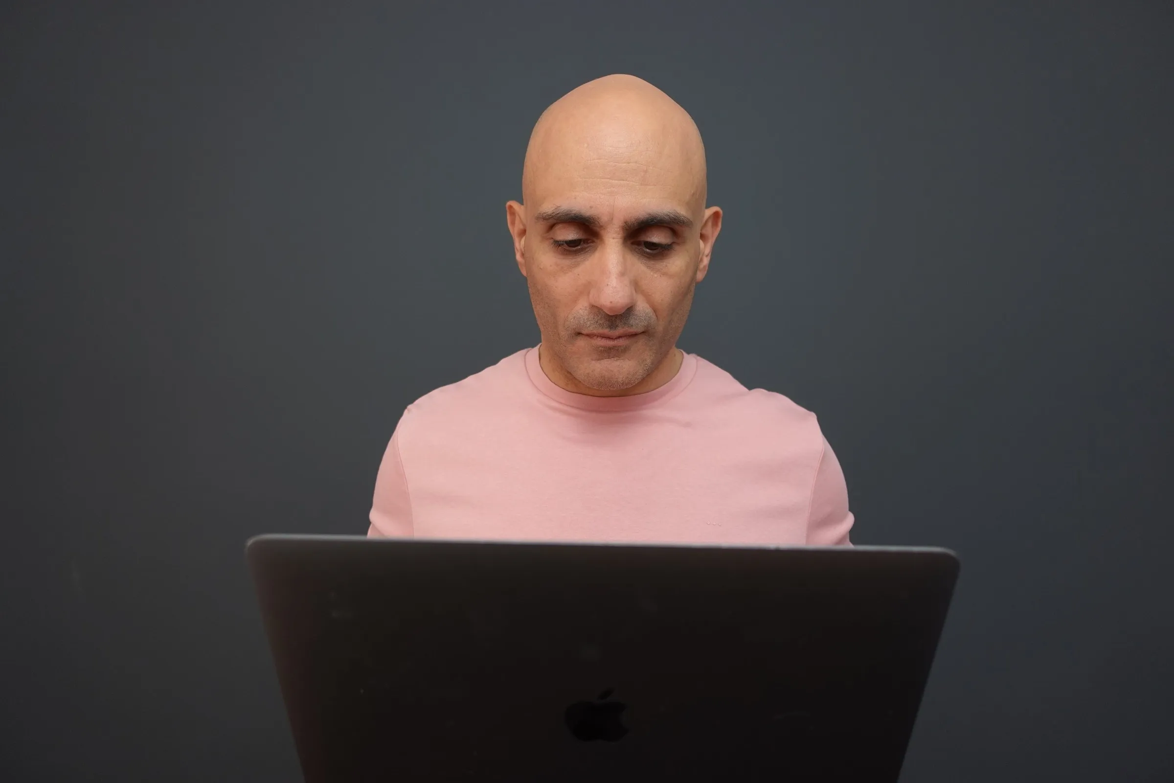 Chris K working through a plan at his laptop